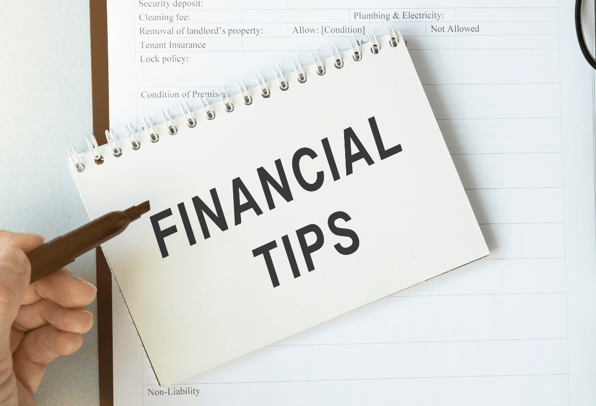 A notebook with the words financial tips highlighting the financial advice given in the article for retirement. 