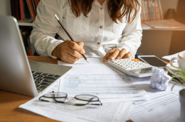  A person reviewing financial documents and preparing to rebudget in response to the energy crisis