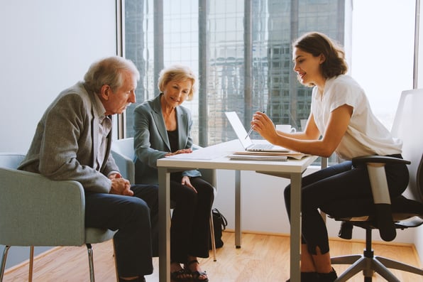 Older couple meeting with financial adviser