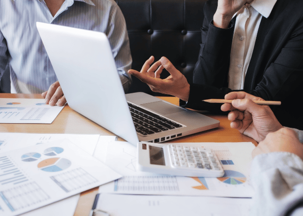 Financial auditor calculating with valuation report