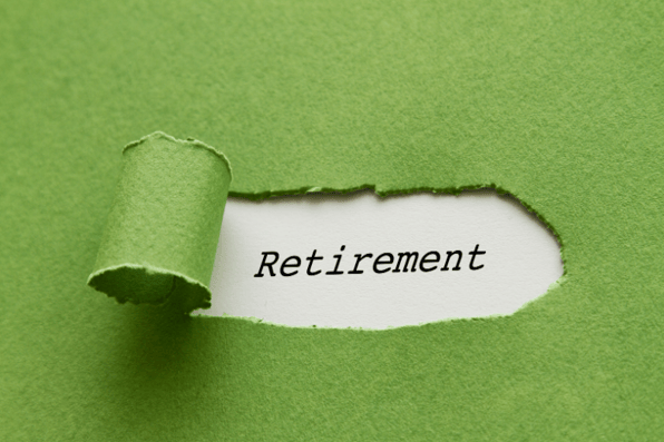 The word retirement behind green paper, preparing for retirement in your early years